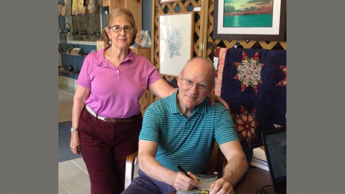Author Bob McCarthy and his wife, Sue, signing a book at UpFront Gallery (FCAC) in Franklinton, North Carolina.