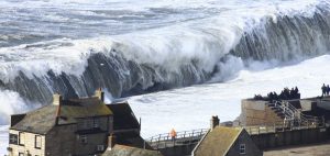 Extreme waves crashing on Chesil Beach in Dorset in southern England on February 5, 2014. A new study finds find global warming could cause extreme sea levels to increase significantly along Europe’s coasts by 2100. Image credit: Richard Broome.