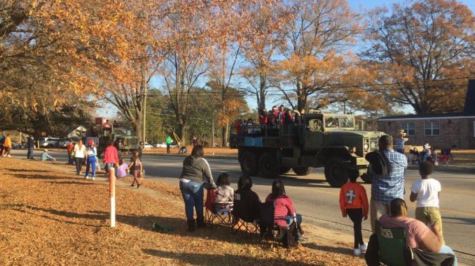 Army vehicles driving up Gannon Avenue in the 2017 Christmas Parade in Zebulon NC. Photo: Kay Whatley