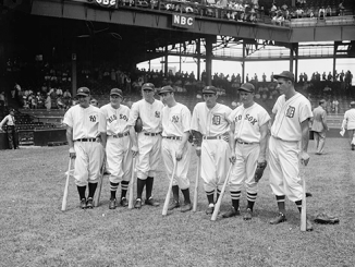 Members of the 1937 American League All-Star team, Lou Gehrig, Joe Cronin, Bill Dickey, Joe DiMaggio, Charlie Gehringer, Jimmie Foxx and Hank Greenberg gather on the field for the fifth annual All-Star Game in Washington, D.C. Source: Library of Congress