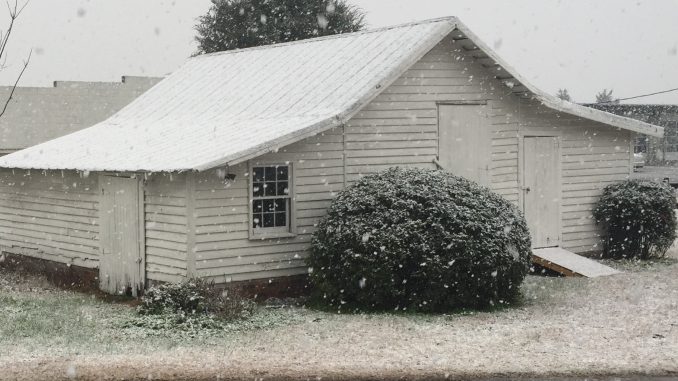 Snow falling on a Nash County, North Carolina farm building. Photo: Kay Whatley